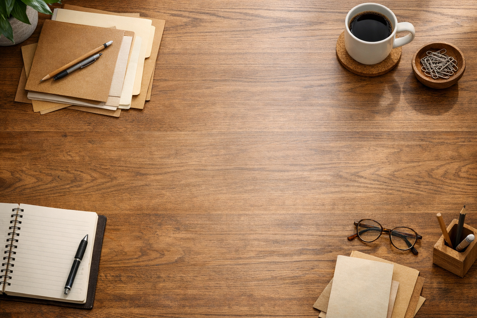 A calm office desk with folders, a notebook, and a cleared space representing work removed by an AI agent